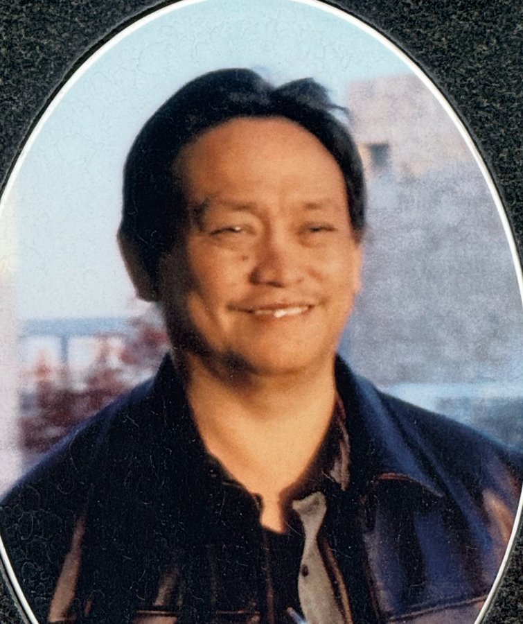 Judge Rosales smiling, in a dark leather jacket