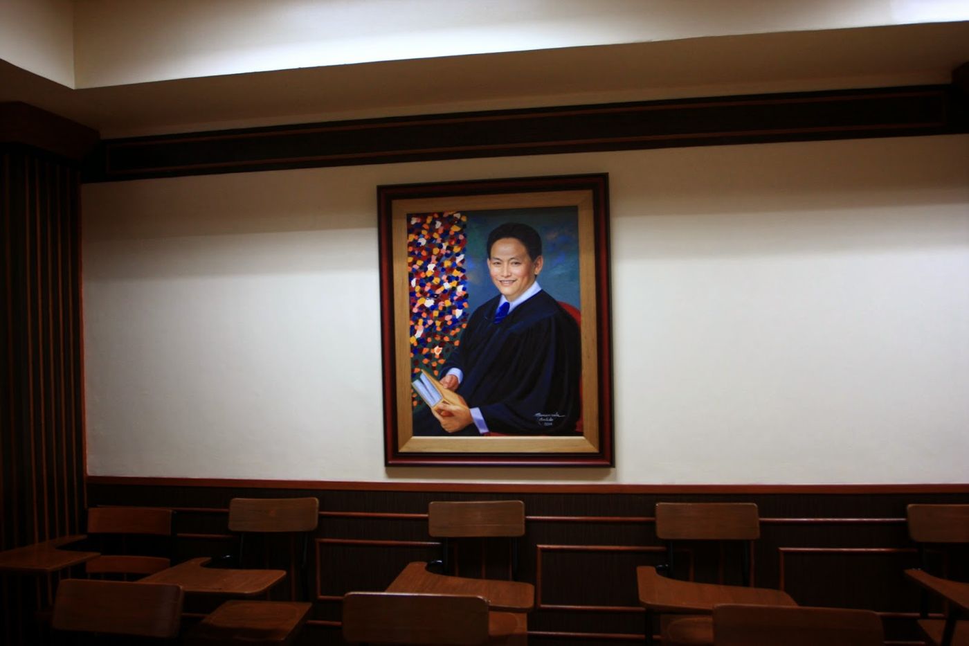 Painted portrait of Judge Rosales in judicial robes