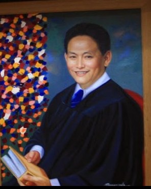 Painted portrait of Judge Voltaire Y. Rosales in judicial robes